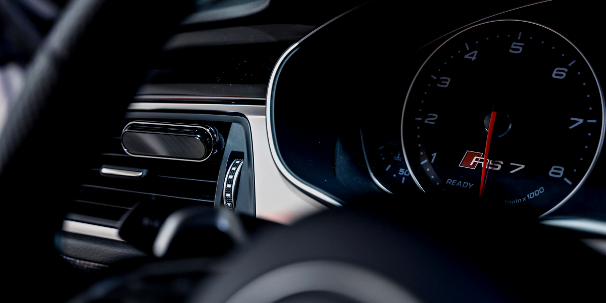 Smul luxury car air freshener attached to a car vent in an Audi RS7