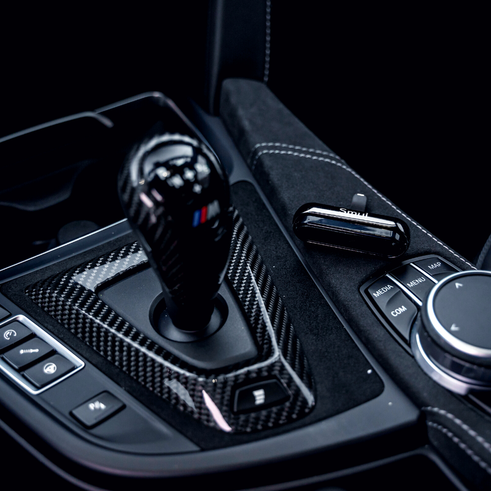 Smul luxury car air freshener unit is near shifter in a BMW M4